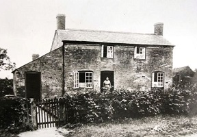 Historic House with a person at the front door